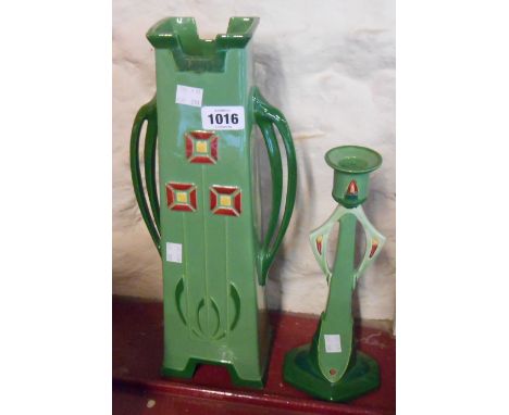 A large Eichwald Secessionist vase decorated with stylised flower heads with a green glazed ground (restoration to rim) - sol