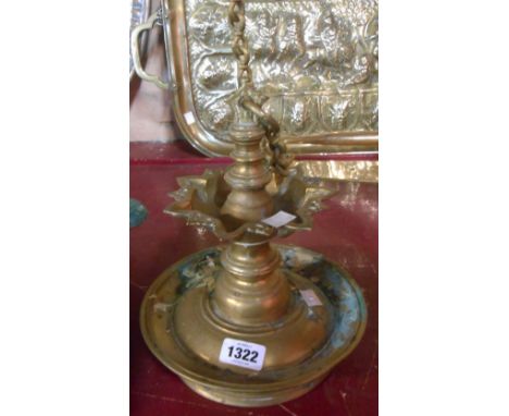An old cast brass hanging incense burner lamp with decorative chain