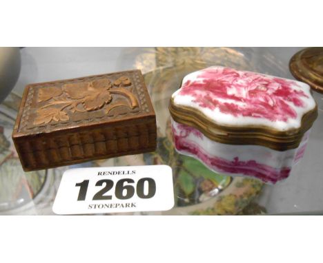 A 19th Century continental porcelain patch box with puce hand painted Watteau style scenes - sold with a Black Forest carved 
