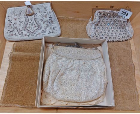 A vintage lady's purse style handbag with silver thread decoration in original box, a beaded and sequined similar and another