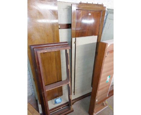 A 1.4m Edwardian mahogany and strung double wardrobe with moulded cornice, slides and hanging space enclosed by a pair of pan