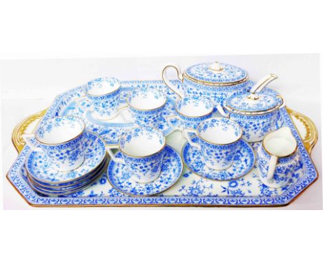 A late 19th Century Royal Crown Derby cabaret set in the Osborne pattern comprising teapot, sucrier, milk jug, six cups and s