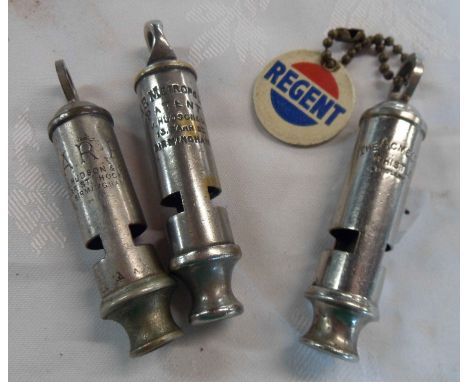 Three vintage whistles comprising ARP, Acme and Metropolitan - sold with a Regent Havoline motor oil keyring