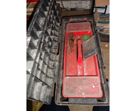 A large plastic toolbox containing a quantity of assorted tools