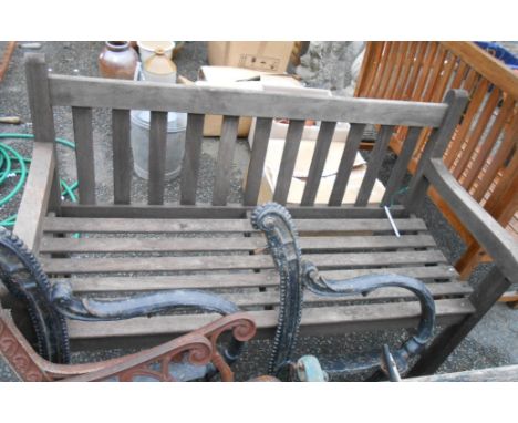 A teak two seater garden bench