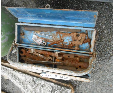 A vintage metal toolbox containing a large quantity of spanners