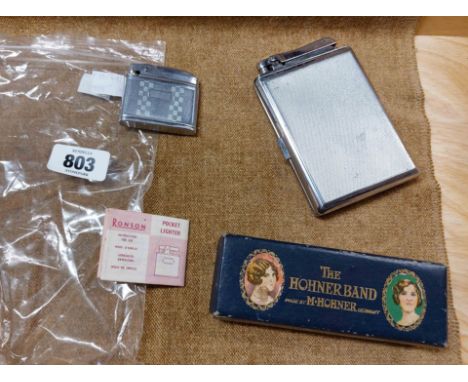 A bag containing a vintage boxed Hohner Band harmonica, a Calibri Monopol combination cigarette case/lighter, etc.