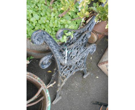 A pair of 20th Century cast iron bench ends