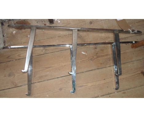 A pair of vintage chrome plated wall brackets for glass shelving