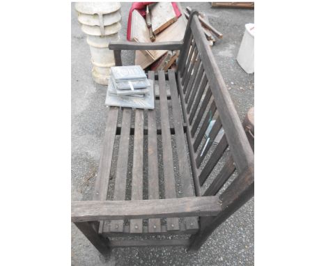 A teak two seater garden bench