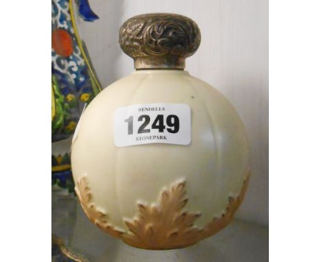 A Locke &amp; Co. Worcester porcelain scent bottle of globe form with moulded acanthus leaf design on an ivory ground and sil