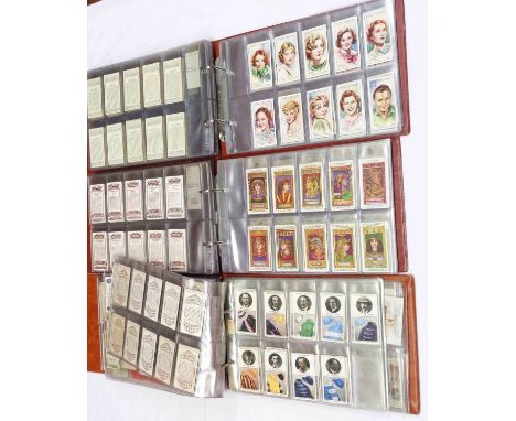 Three 'The Nostalgia' ring bound albums containing collections of sets and part sets of cigarette and other trade cards inclu