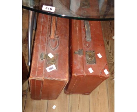 A vintage leather suitcase with brass locks and initials L.J.P. - sold with a fibreboard similar