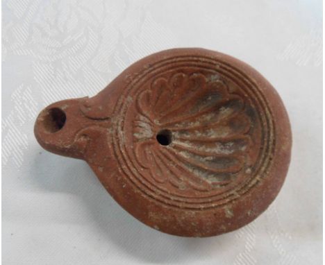 An early Grand Tour terracotta oil wick lamp