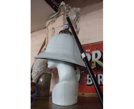 An old colonial governor's department pith helmet with silver plated feather set finial - sold with a leather covered swagger