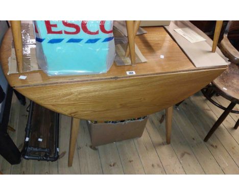 A Mid-Century Ercol light elm circular drop leaf dining table, set on chamfered legs - 125cm diameter overall
