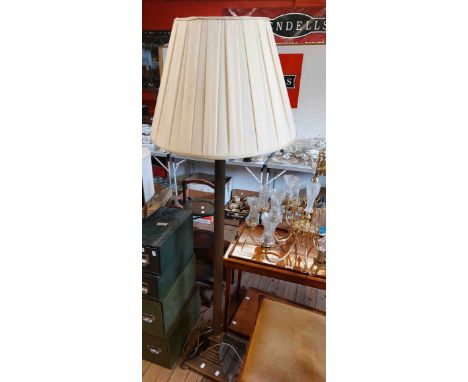 A modern brass Corinthian column standard lamp with stepped square base and shade