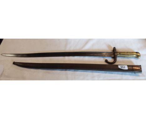 A French 1868 pattern sword bayonet and brass hilt with scabbard with applied French 1854 coin