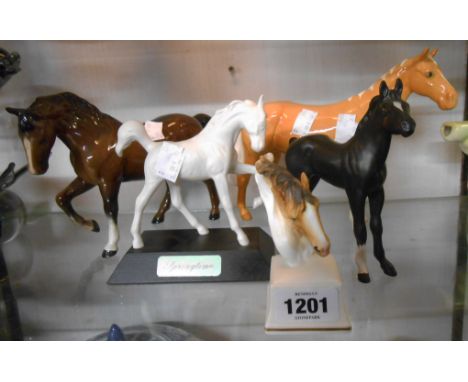 A Beswick Arab Bahran palomino Model 1771 horse, a Beswick brown colourway prancing horse, a Beswick matt finish springtime p