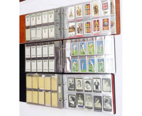 Three ring bound albums containing collections of sets and parts sets of cigarette cards including numerous John Player examp