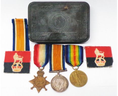 SE - 5865 Pte. A.J. Watts. Army Veterinary Corps: a group of three World War I medals, spare ribbon and two patches contained