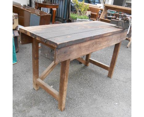 An old pine workshop bench of plank construction, fitted with a Record No.3 vice