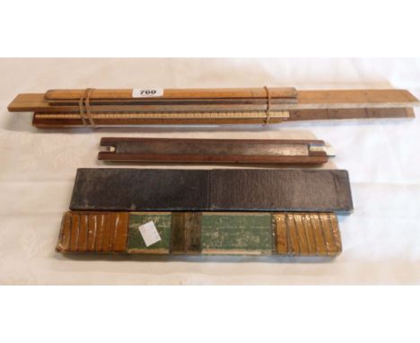 A selection of vintage boxed and loose slide rules and rulers