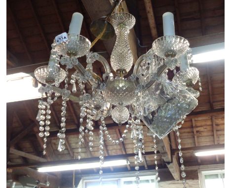 A vintage six branch moulded glass electric ceiling chandelier with cut drops - some detached but present