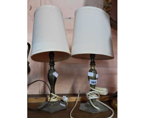 A pair of vintage cast brass table lamps of faceted pillar form