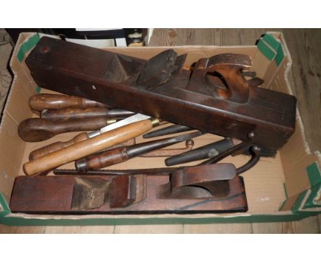 A box containing a quantity of old woodworking and other tools