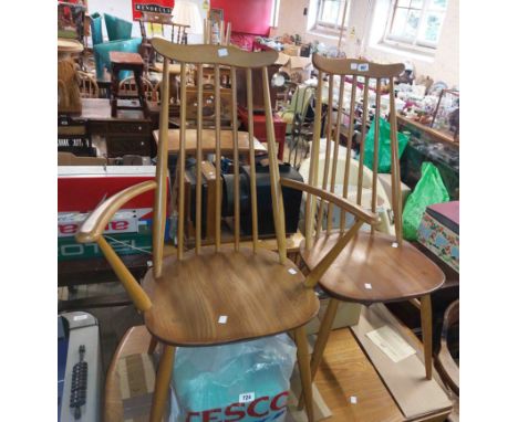 Four Mid-Century Ercol light elm stick back dining chairs with moulded sectional seats, set on slender supports - comprising 