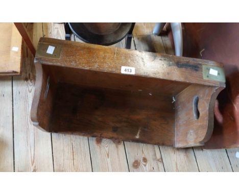 A 53cm heavy oak and brass bound book trough with flanking pierced handles