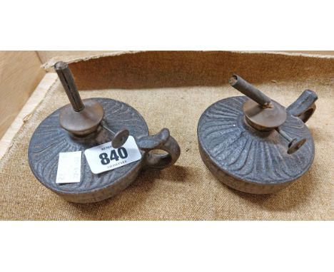 A pair of Victorian cast iron oil lamps, each marked for Wells &amp; Co. to one side with Wells Unbreakable Lamp to the other