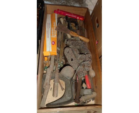 A wooden drawer containing a quantity of hand tools, shoe lasts and assorted metalware