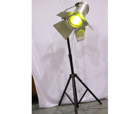 Tall adjustable standard lamp converted from a large aluminium stage light, with barn doors and yellow filter on tripod, maxi