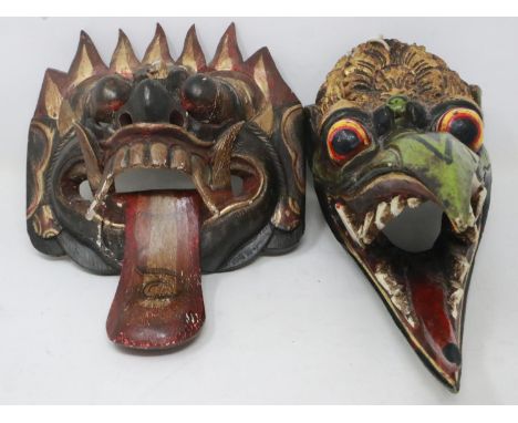 Two Indonesian wooden face masks, largest L: 27 cm. UK P&amp;P Group 2 (£18+VAT for the first lot and £3+VAT for subsequent l