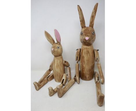 Two wooden articulated shelf rabbits, largest H: 57 cm, both rabbits have scuffs, other than that there appears to be no othe