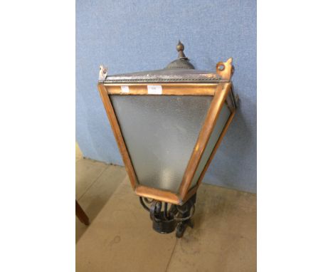 A copper and wrought iron lantern