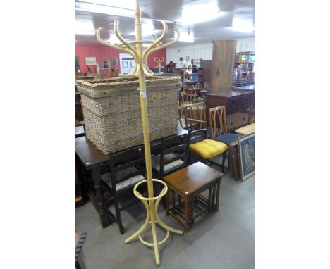 A bentwood coat stand and an oak nest of tables