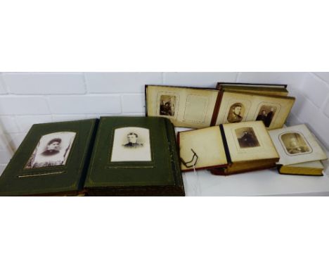 Four Victorian and later leather bound photograph albums containing a selection of portrait photographs, (4) 