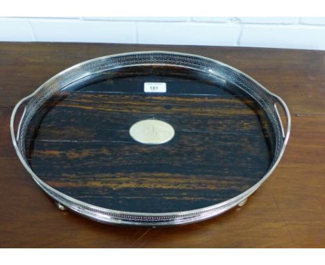 An Epns rimmed gallery tray with wooden insert on four bun feet