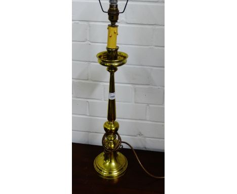 A brass stemmed table lamp base and shade