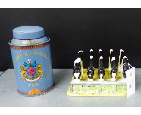 A Border Fine Arts, James Heriot Country Kitchen five calves toast rack, together with a Jackson's of Piccadilly tin tea cadd