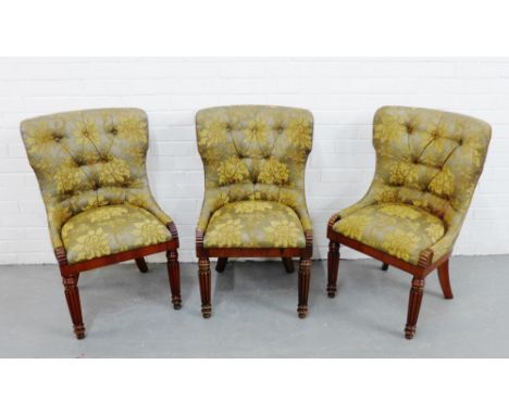 Three rosewood framed chairs, with upholstered button backs and seat, raised on turned and reeded supports  (3) 