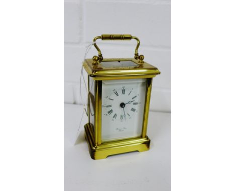 A brass cased carriage clock, the movement inscribed Bornand Freres, 15cm high