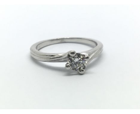 A platinum and diamond solitaire ring, approx 0.25ct, size approx H