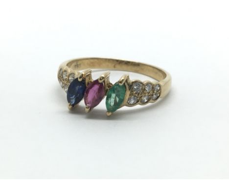 A 14ct yellow gold multi stone ring, the central sapphire, ruby and emerald flanked by six diamonds, ring size approx L/M