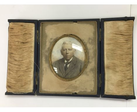 A Victorian miniature cased portrait of a well dressed gentleman.
