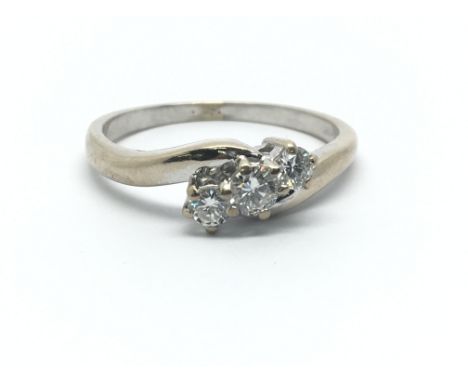 An 18ct white gold three diamond ring, approx 0.33ct, ring size Q/R