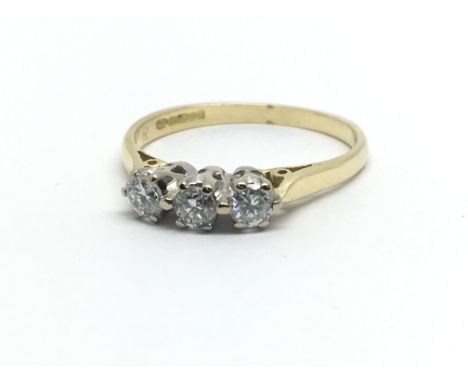 An 18ct yellow gold and three stone diamond ring, approx 0.5ct, ring size approx K/L